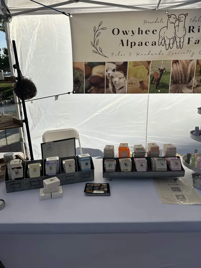 Owyhee River Alpaca Farm booth at a farmers market